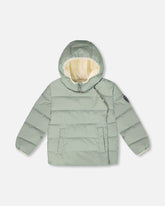 Manteau d’hiver compressible conçu pour siège d’auto vert sauge