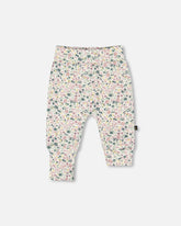 Pantalon évolutif blanc cassé fleuris en coton biologique