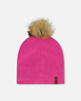 Bonnet en jersey mi-saison avec pompon rose bonbon